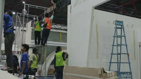 Worker using high-rise skyscraper in exhibition area 스톡 동영상 290849935