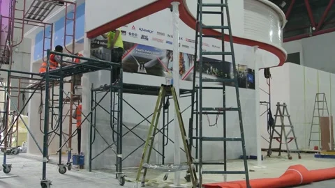 Worker using high-rise skyscraper in exhibition area 스톡 동영상 290880388