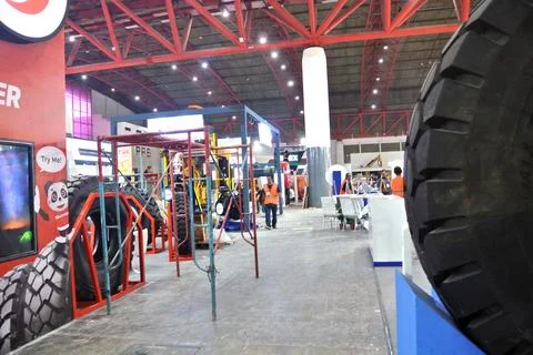 Worker using high-rise skyscraper in exhibition area Stock Photos