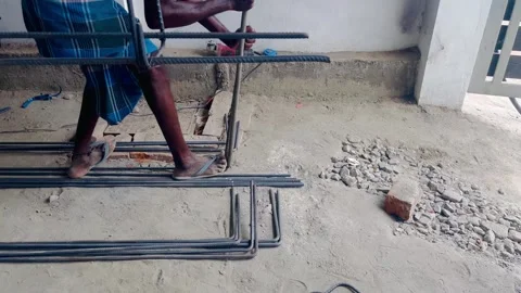 Worker using his hand power manually moulding the steel bar Stock Footage 274468316