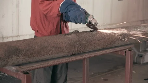 Worker using industrial grinder. 4K Video stock 86682019