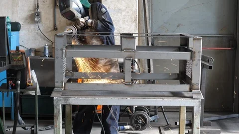 Worker using industrial grinder. Filmed in 4K Stock-Footage 91137850