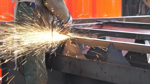 Worker using industrial grinder. Filmed in 4K Stock Footage 93548771