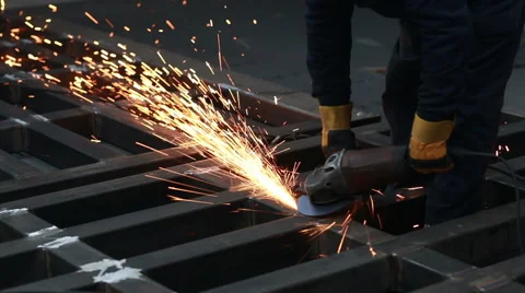 Worker using industrial grinder Stockbeeldmateriaal 62442233