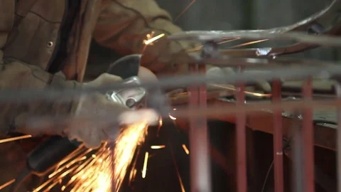 Worker using industrial grinder on metal Stock-Footage 72068817