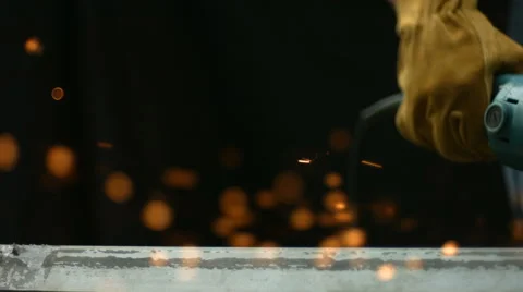 Worker using industrial grinder, slow motion Stock Footage 62282331