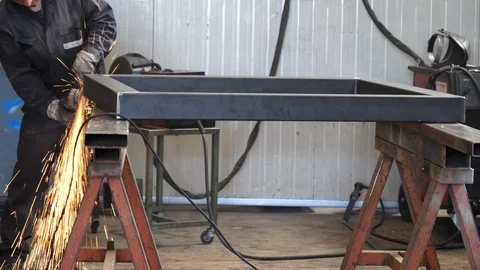 Worker using industrial grinder, slow motion Stock Footage 91149561