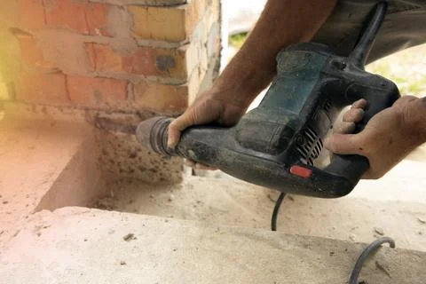 Worker using jackhammer Stock Photos