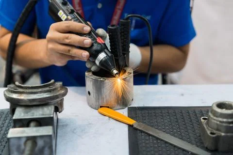 Worker using machine for coating and overlay steel for maintenance and repair Stock Photos
