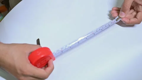 Worker using measuring tape during construction work Stock Footage 337136648