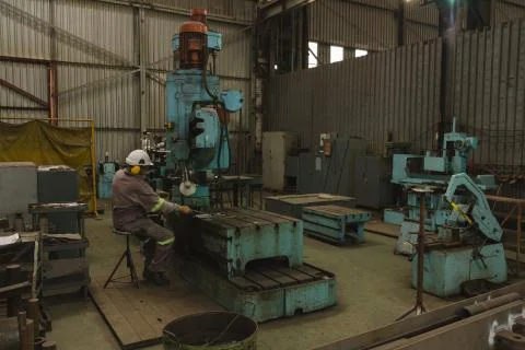 Worker using pipe binder machine Stock Photos