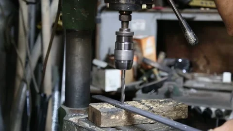 Worker Using Power Drill on Metal Stock Footage 340109462