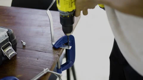 Worker Using Power Drill On Steel Surface Stock Footage 339257865