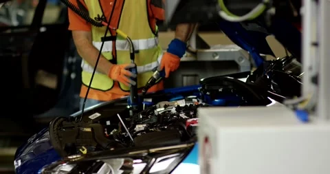 Worker Using Power Tool at Car Engine Bay, Automotive Assembly, Close Up Shot Stock Footage 340302514