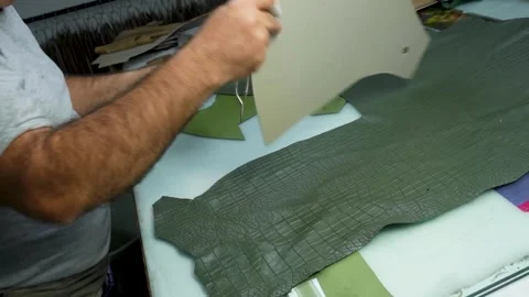 Worker Using Scissors to Cut Pattern on Leather izmir, turkey, 5 october 2025 Stock Footage 322057726