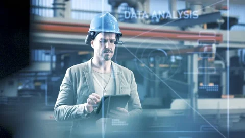 Worker using smart augmented reality goggles device in industrial hall company	 Stock Footage 149297414
