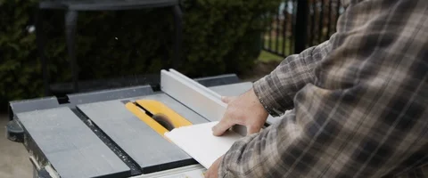 Worker Using a Table Saw to Cut Wood (6K) Stock Footage 120409985
