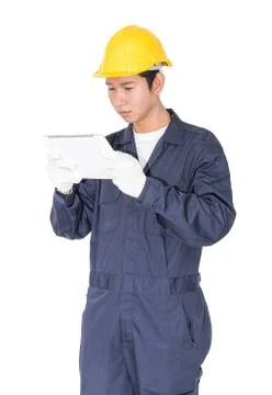 Worker using a tablet and holding blueprint on white Stock Photos