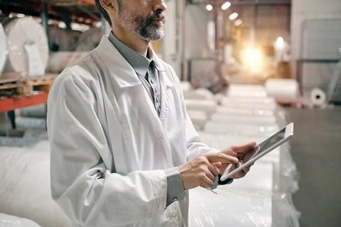 Worker using tablet at the factory Stock Photos