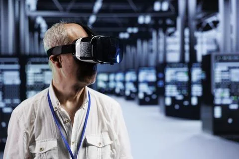 Worker using VR in data center 스톡 사진