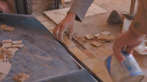 Worker using water to assemble slabs on a floor in building site. Video stock 110771513