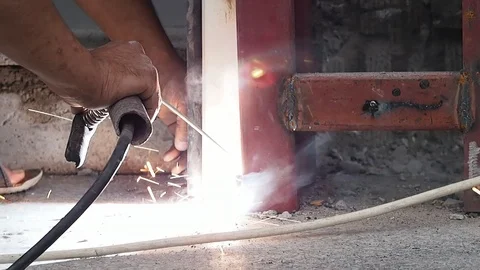 Worker using welding machine for welding Stock Footage 93487437