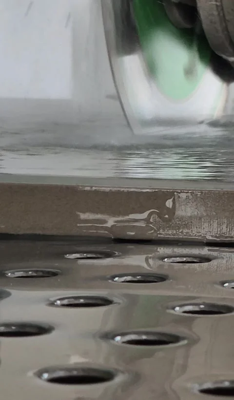 Worker Using Wet Stone Saw to Cut Floor Panel Vertical Stock-Footage 332874560