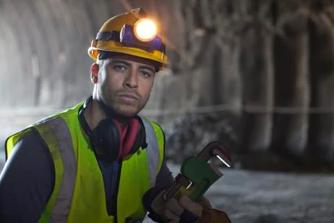 Worker using wrench in tunnel Stock Photos