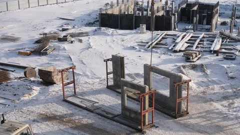 Worker waits for suspending panel to hook to build house Stock Footage 124892410