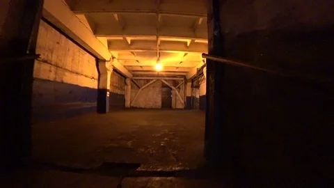 Worker walk through a dark corridor at a metallurgical plant. POV, Stock-Footage 106450307