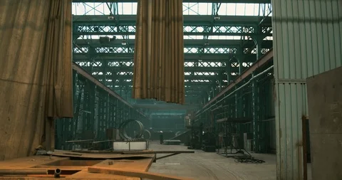 Worker walking alone in old communist factory Stock Footage 129849799