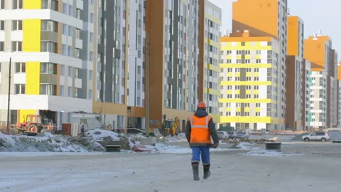 Worker walking to the construction site Stock Footage 86927106