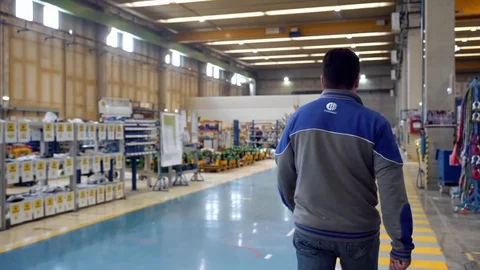 Worker Walking Down Factory Hall Man Operator  Vídeo Stock 128492546