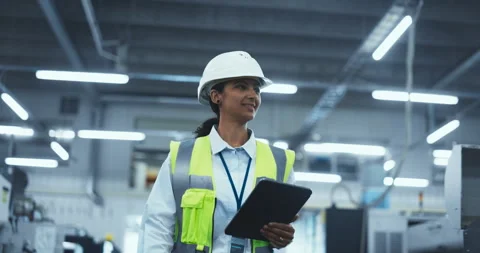 Worker Walking in a Factory with Tablet Computer Stock Footage 295298830