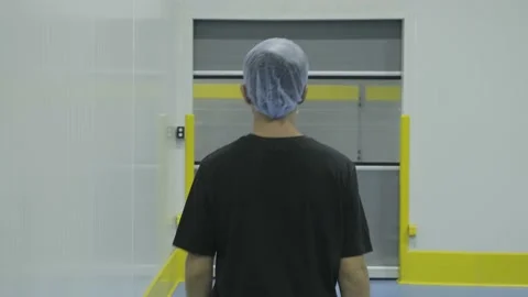 Worker Walking through an Automatic Door at the Factory. Video stock 135277677