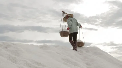 Worker Walks down Mountain of salt Another Dumps Salt Stock Footage 42424721