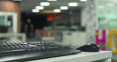 Worker walks through modern open plan office smart energy saving ceiling lights Stock Footage 156681065