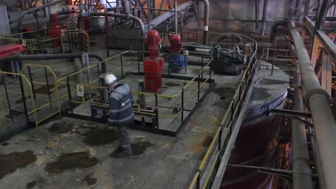 A worker walks in the workshop and controls the production process. Stock Footage 124192808