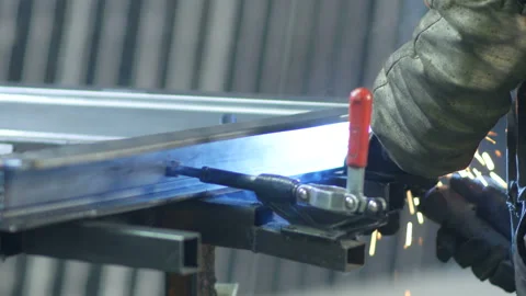 Worker ware equipment safety and mask Tig welding steel pipe in factory Stock Footage 97720923