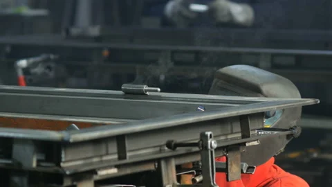 Worker ware equipment safety and mask Tig welding steel pipe in factory Stock Footage 102467841