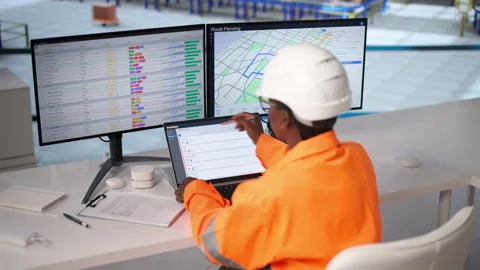 Worker In Warehouse Uses Computer To Manage Inventory Stock Footage 337643933