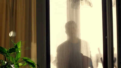 A worker washes a window at home, uses special tools Stock Footage 129991050