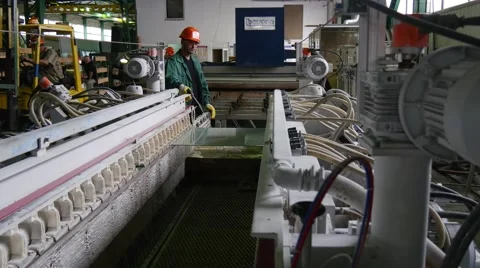 Worker is Washing The Glass Sheets, Worker is Sitting in a Loader, Workers are Stock Footage 52873356