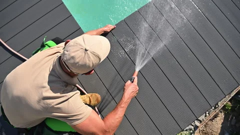 Worker Washing Swimming Pool Composite Deck Stock Footage 241085040