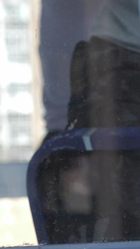 Worker washing window at home before installing tint film. Man tinting windows Stock Footage 327125877