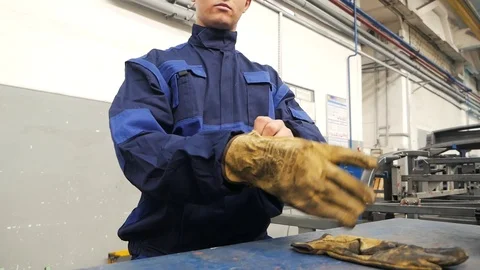 Worker wearing mittens Stock Footage 94042229