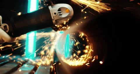 A worker wearing protective gloves cuts a metal pipe using an electric manual Video stock 167370385