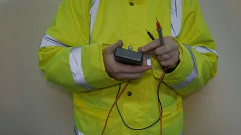 Worker Wearing Reflective Uniform Checking Voltage Stock-Footage 220016857