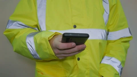 Worker Wearing Reflective Uniform Talking On The Phone Stock-Footage 220016735