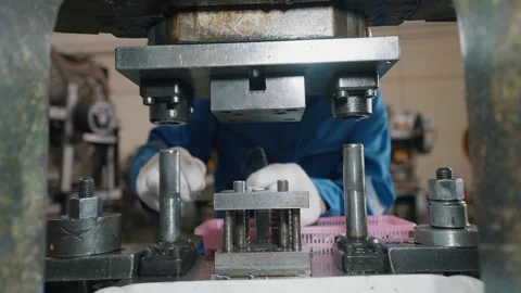 Worker wears gloves, carefully handles metal parts Stock Footage 338066235